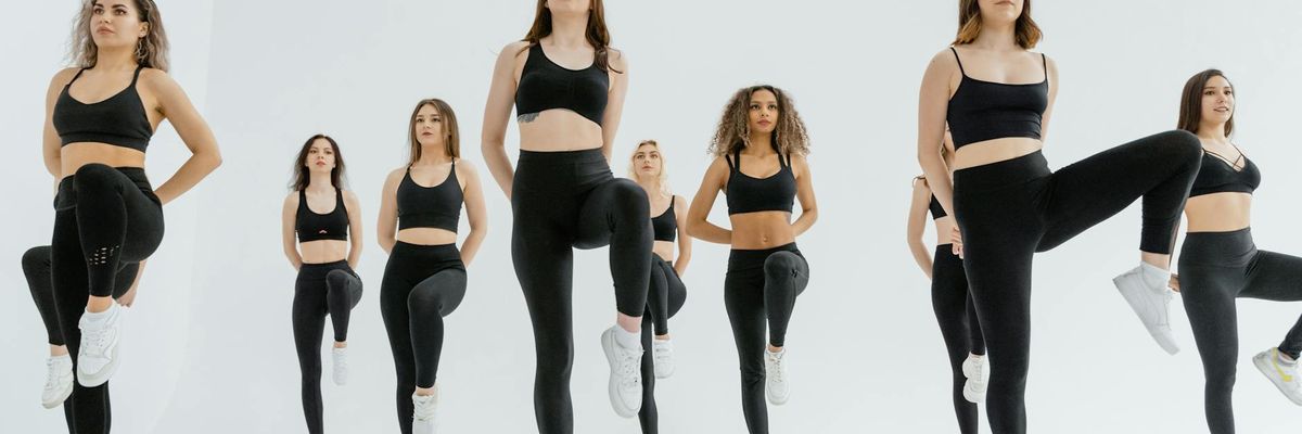 Group of people practicing group movement in a modern studio